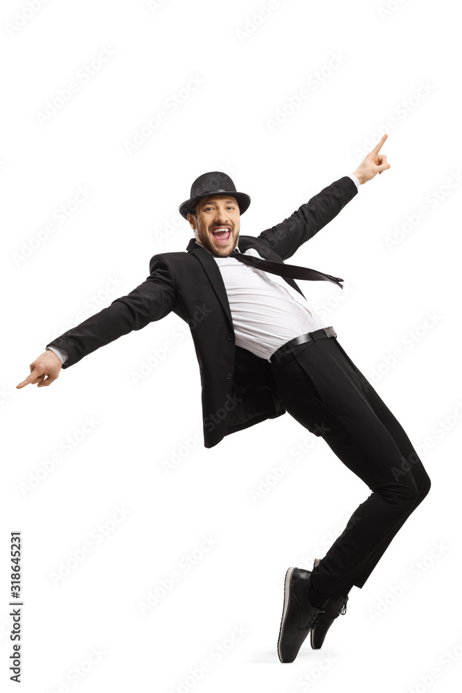 Smiling guy in a suit dancing and pointing with fingers Smiling guy in a suit dancing and pointing with fingers