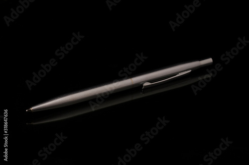 Wallpaper Mural Silver metal pen on black  background Torontodigital.ca