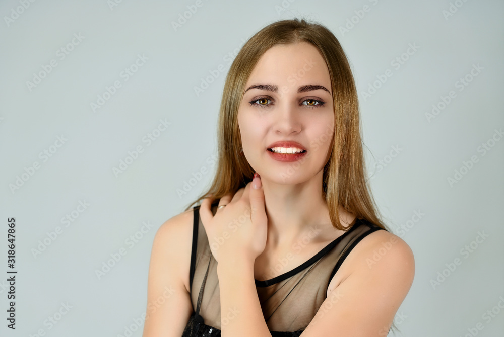 A close-up portrait of a pretty Caucasian model with excellent facial skin and good makeup on a white background. Cosmetics concept, facial skin care. A close-up portrait of a pretty Caucasian model with excellent facial skin and good makeup on a white background. Cosmetics concept, facial skin care.
