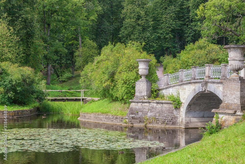 Picturesque alleys and bridges are the best place for hiking in the park of the Pavlovsk Palace, St. Petersburg, Russia Picturesque alleys and bridges are the best place for hiking in the park of the Pavlovsk Palace, St. Petersburg, Russia