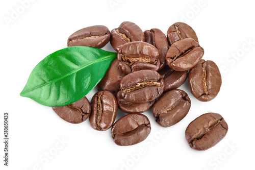Heap of roasted coffee beans with leaves isolated on white background with clipping path and full depth of field . Top view. Flat lay.