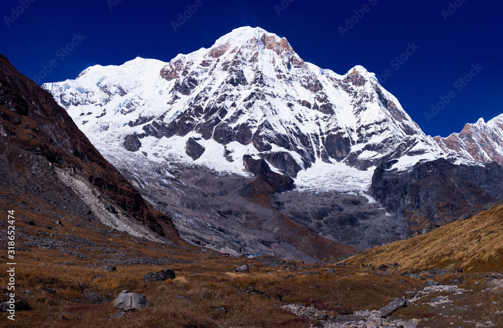 Obraz premium Mount Gangapurna one of the prominent mountain seen from Annapurna Base Camp with the trekking path in the foreground