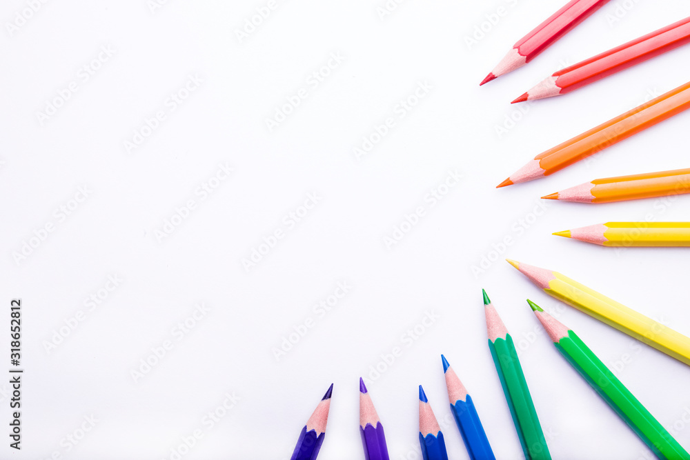 Fototapeta premium Different color pencils on white background. Composition with colored pencils, closeup view, space for text