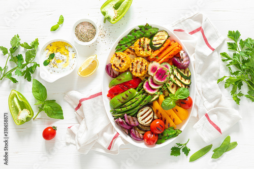 Grilled vegetables on a white plate, top view