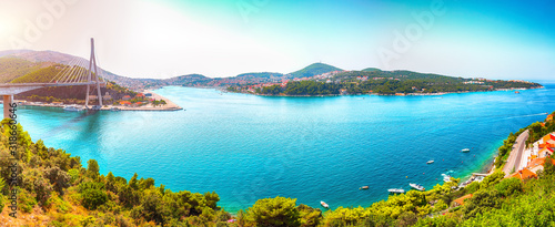 Panorama of impressive Franjo Tudjman bridge and blue lagoon with harbor of Dubrovnik
