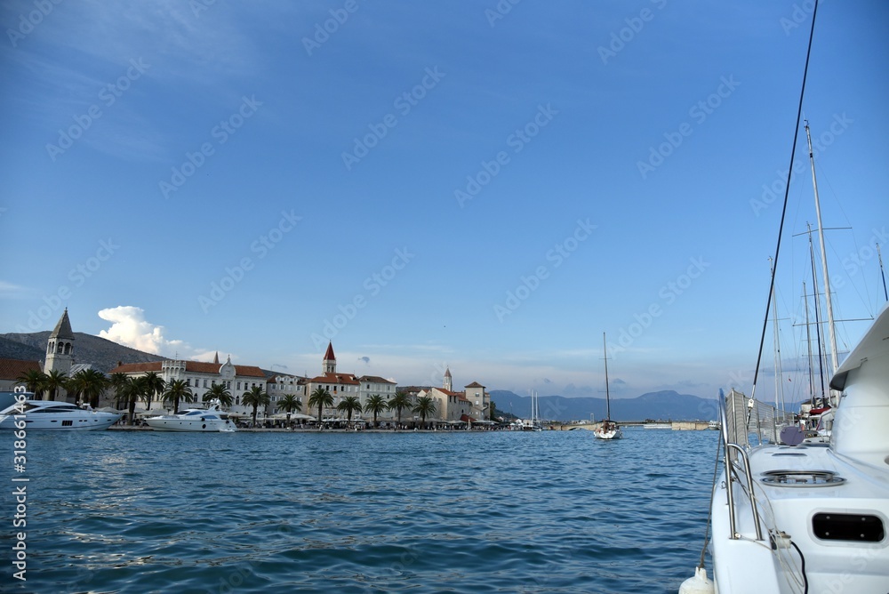 Fototapeta premium Sailing to Trogir Croatia - Segeln vor Trogir in Kroatien mit Katamaran