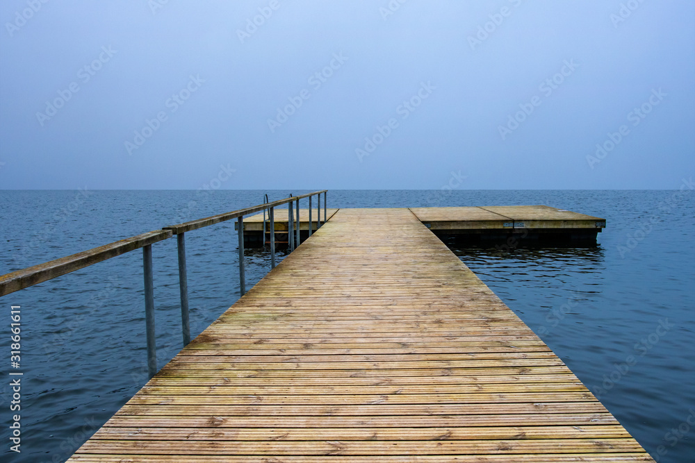 Wooden pier  going into the water.