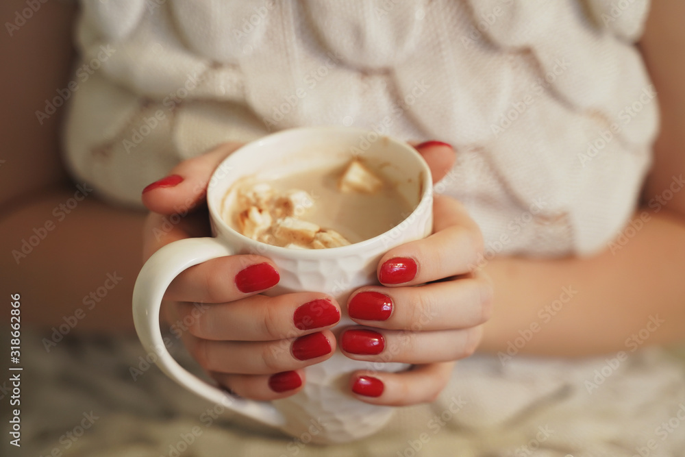 Female hands with coffee drink, knitted sweater Female hands with coffee drink, knitted sweater