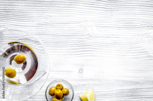 martini and shaker top view of wooden background