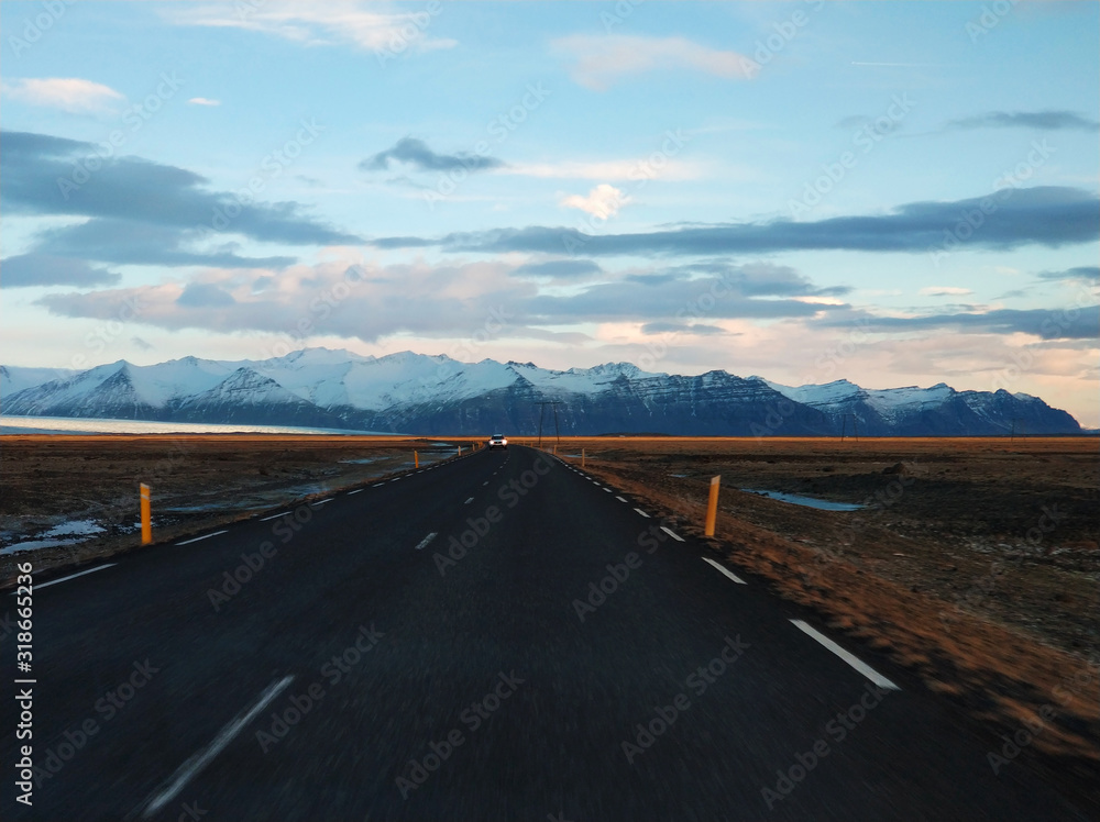 Fototapeta premium Picturesque winter landscape of Iceland. The perfect road to perspective