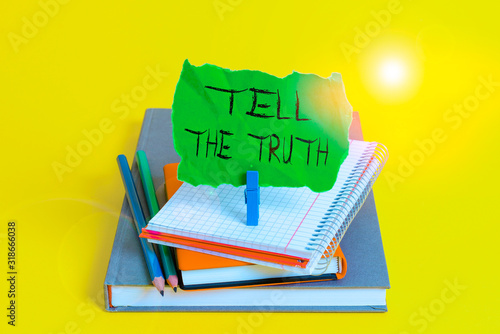 Text sign showing Tell The Truth. Business photo showcasing Confess some demonstratingal fact that someone wants keeps hidden Book pencil rectangle shaped reminder notebook clothespin office supplies photo