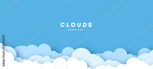 Beautiful fluffy clouds on blue sky background. Vector illustration. Paper cut style. Place for text.