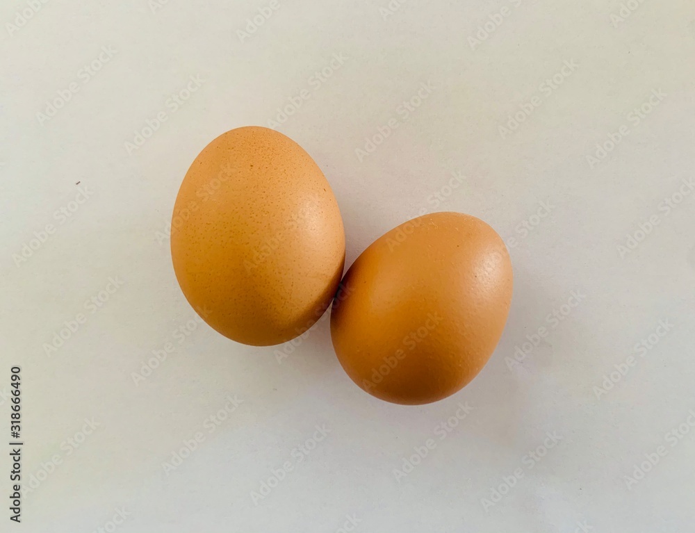 two brown eggs isolated on white background two brown eggs isolated on white background