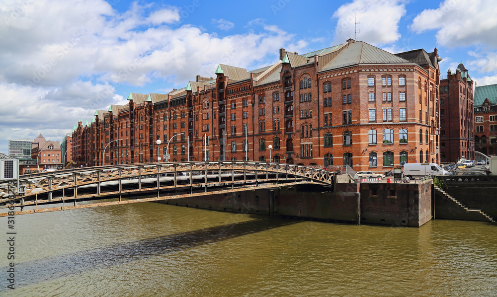 Canal with historical warehouses in Speicherstadt district in Haburg, Germany