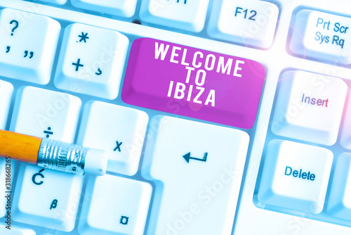 Handwriting text writing Welcome To Ibiza. Conceptual photo Warm greetings from one of Balearic Islands of Spain White pc keyboard with empty note paper above white background key copy space