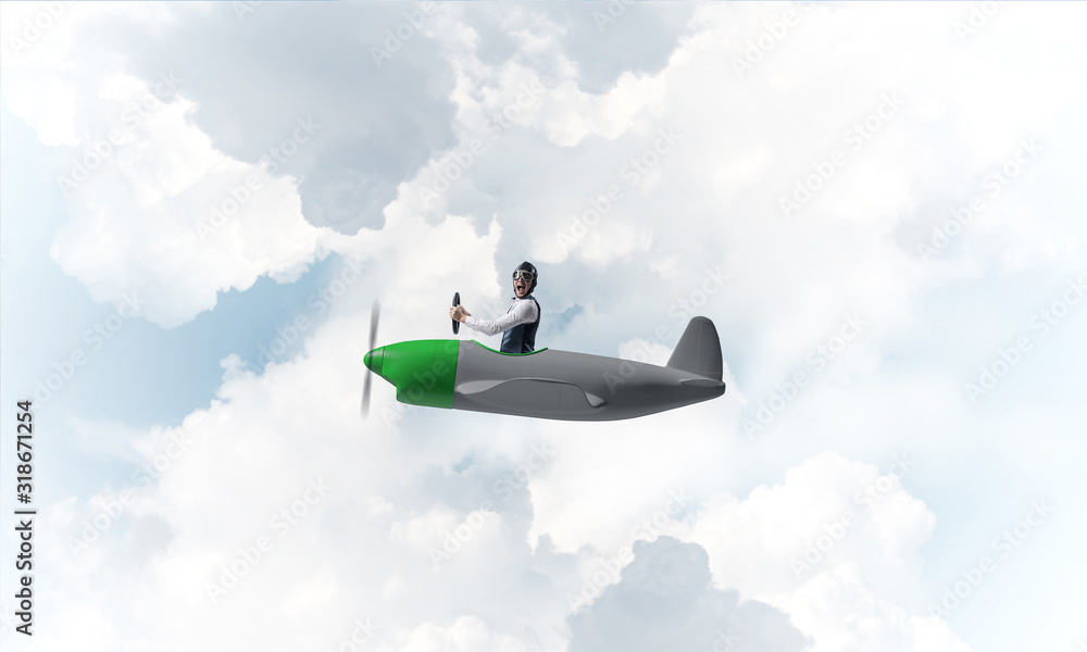 Man in aviator hat driving propeller plane Man in aviator hat driving propeller plane