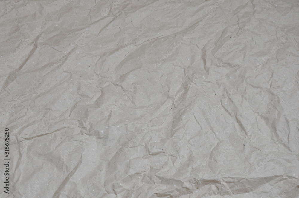 Top view beige crumpled wrapping paper. background