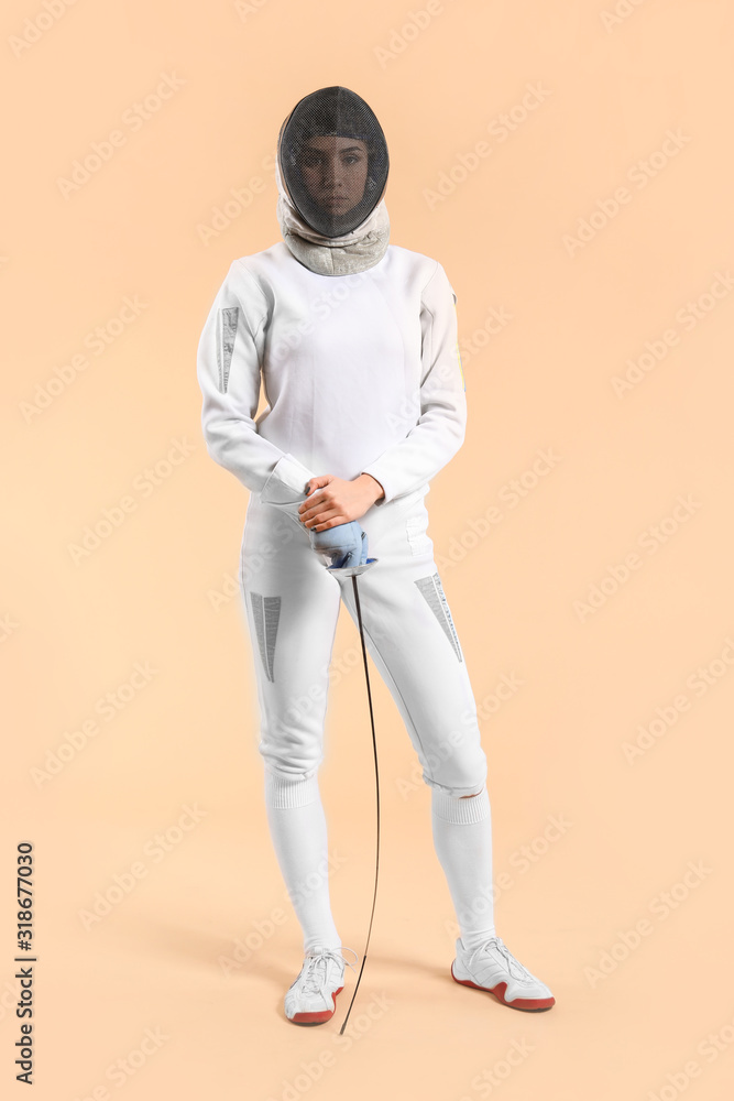 Fototapeta premium Young female fencer on color background