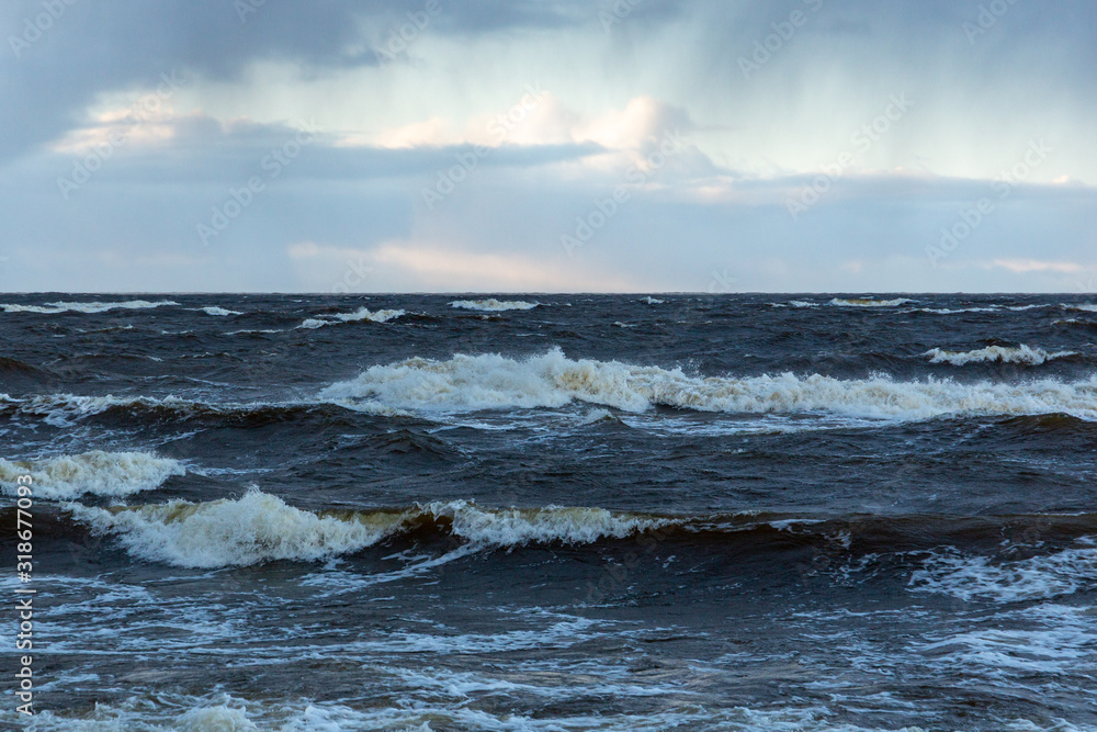 Moody sea view on a windy and cloudy day with waves at the Baltic sea n Latvia