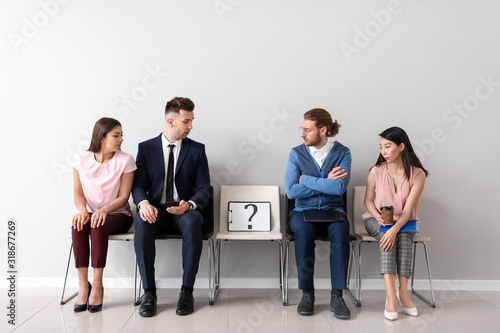 Young people waiting for jo...