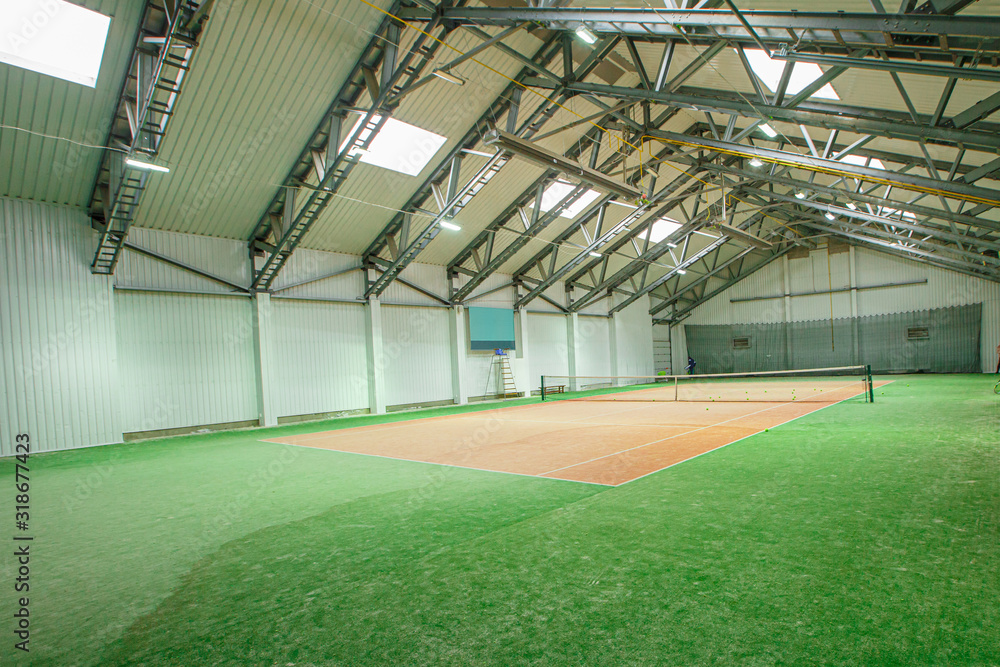 Indoor tennis court in the sports complex Indoor tennis court in the sports complex