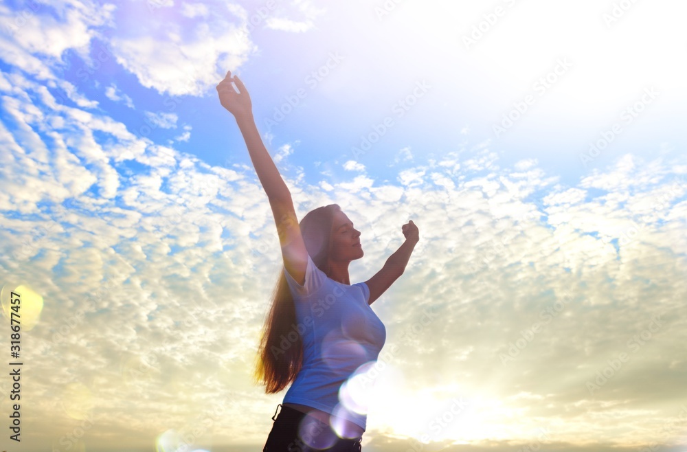 Young relaxed woman on sky background Young relaxed woman on sky background