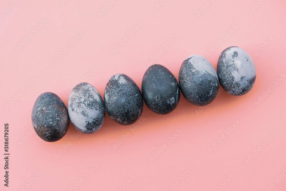 Natural dyed blue colored eggs on pastel pink background. Natural dyed blue colored eggs on pastel pink background.