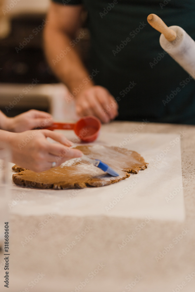 Family making and decorating Christmas cookies Family making and decorating Christmas cookies