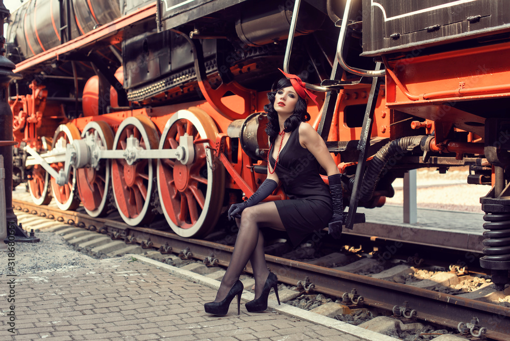© bombardir7 - Young girl at the retro train station © bombardir7 - Young girl at the retro train station