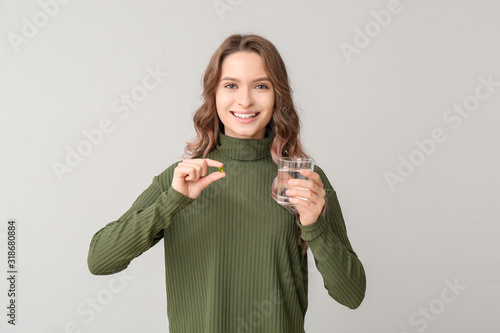 Young woman with fish oil o...
