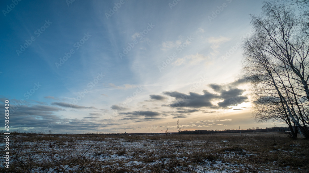 Beautiful setting sun over frozen field Beautiful setting sun over frozen field