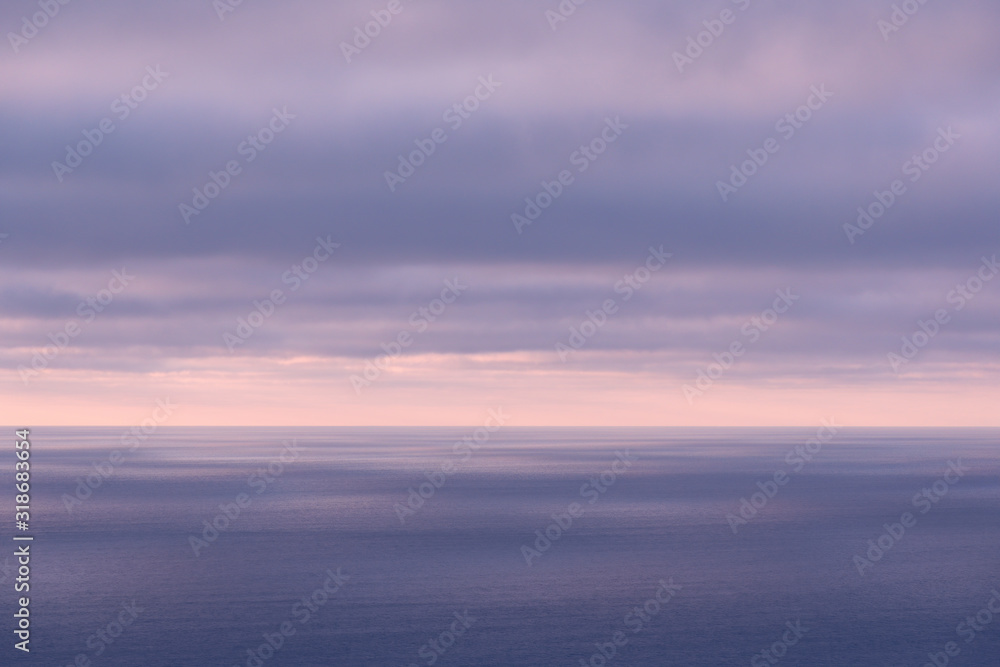 Long aerial view of evening clouds over Tasman sea coast