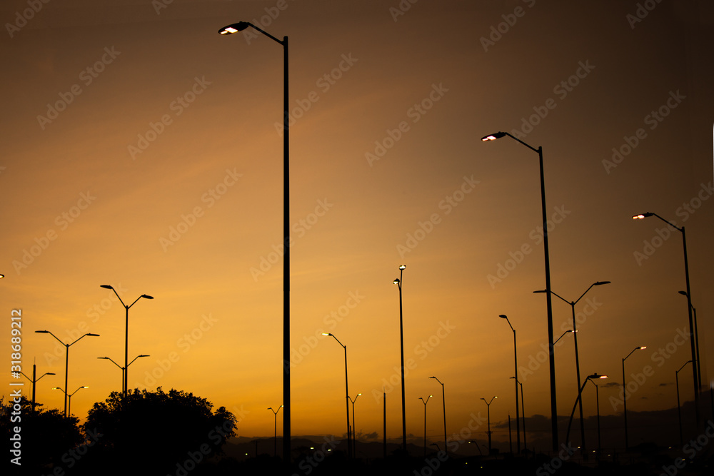 Lamppost at sunset. street lamps over background of a dramatic sky