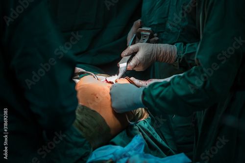 Orthopedic surgeons in teamwork in the operating room with modern arthroscopic tools