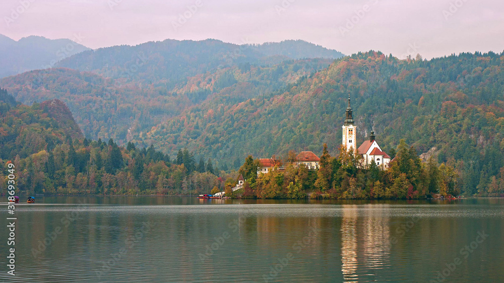 Picturesque view of the island on Lake Bled and Bled castle. Autumn. Slovenia, Europe.