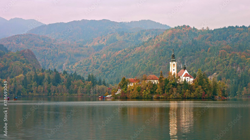 Fototapeta premium Picturesque view of the island on Lake Bled and Bled castle. Autumn. Slovenia, Europe.