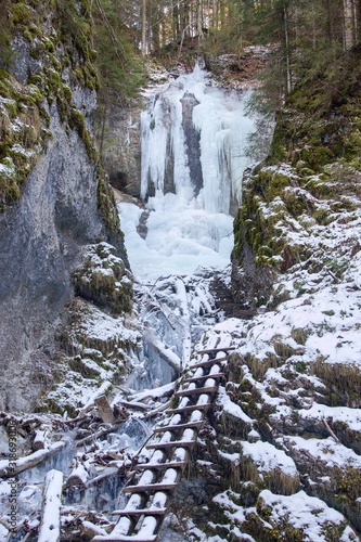 Vy  n   waterfall in winter in Falcon valley  Slovak Paradise National park  Slovakia