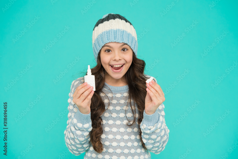 Pharmacy industry. Runny nose remedies. Girl hold nasal drops. Allergy concept. Home treatment. Nasal drops plastic bottle. Effective nasal spray. Flu concept. Symptoms of cold. Side effects Pharmacy industry. Runny nose remedies. Girl hold nasal drops. Allergy concept. Home treatment. Nasal drops plastic bottle. Effective nasal spray. Flu concept. Symptoms of cold. Side effects
