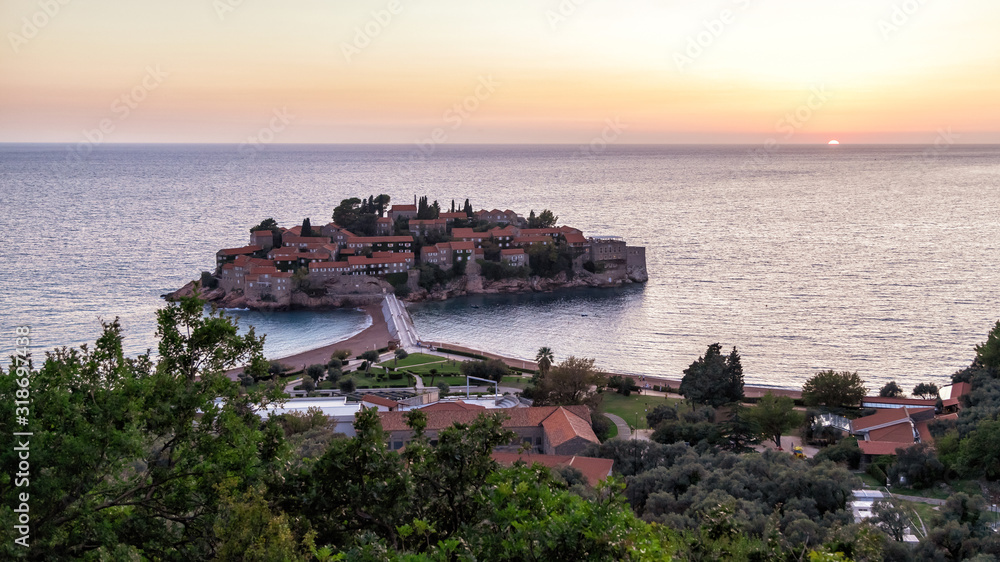 Aerial panoramic view of the island of St. Stephen (Sveti Stefan) at sunset. Montenegro.