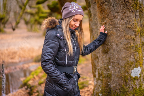 Autumn Lifestyle Session, a young blonde in the magical forest of Otzarreta in a tree, Bizkaia. Basque Country