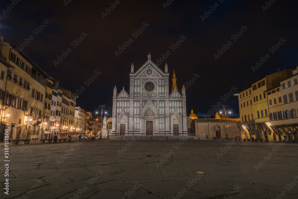 Church of Santa Croce in Florence in Tuscany in Italy during blue hour with empty square and historical old buildings