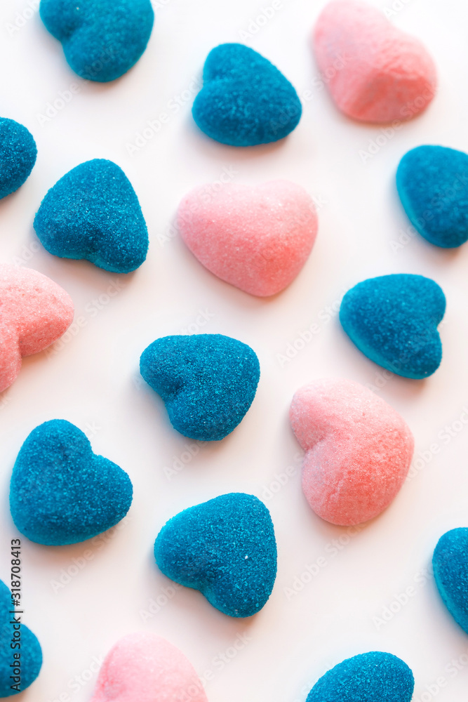 Marmalade and jelly candies sugar hearts blue and pink. Valentine's Day Party Concept. Treats guest children holiday birthday. Vertical banner social network and mobile phone screen selective focus Marmalade and jelly candies sugar hearts blue and pink. Valentine's Day Party Concept. Treats guest children holiday birthday. Vertical banner social network and mobile phone screen selective focus