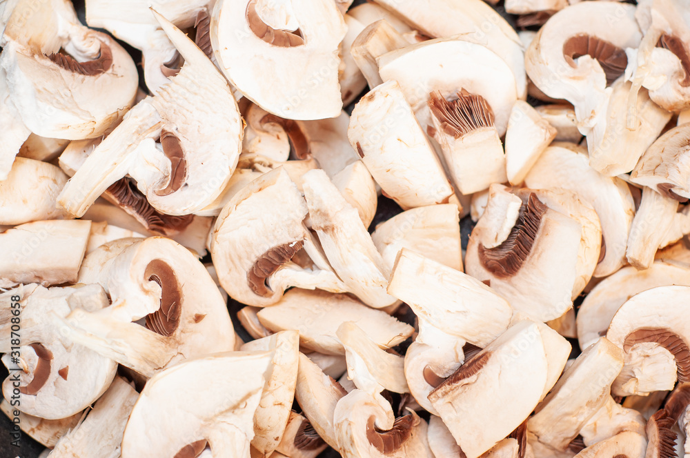 Porcini mushrooms lying sliced in slices of a heating pan close-up. Porcini mushrooms lying sliced in slices of a heating pan close-up.