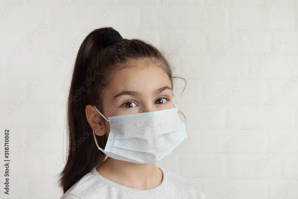Child in a sterile medical mask. Sick little girl. Epidemic of flu. Virus, coronavirus. Child in a sterile medical mask. Sick little girl. Epidemic of flu. Virus, coronavirus.