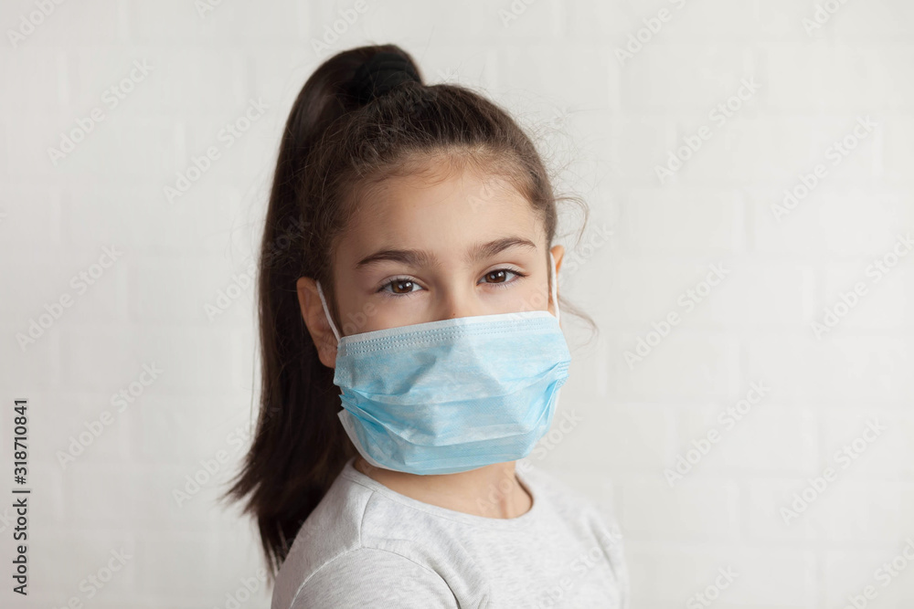 Child in a sterile medical mask. Sick little girl. Epidemic of flu. Quarantine. Child in a sterile medical mask. Sick little girl. Epidemic of flu. Quarantine.