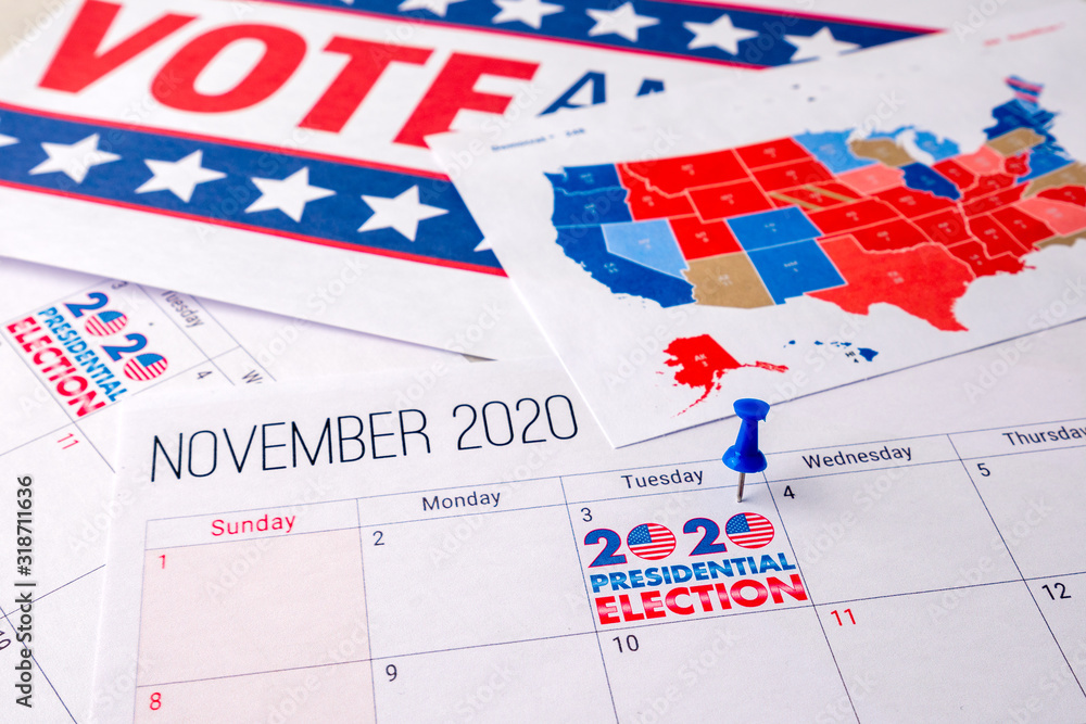 Obraz premium November 2020 presidential election text on calendar concept. To illustrate voting and political campaign in the united states of america this year. Red white and blue colors and the american flag.
