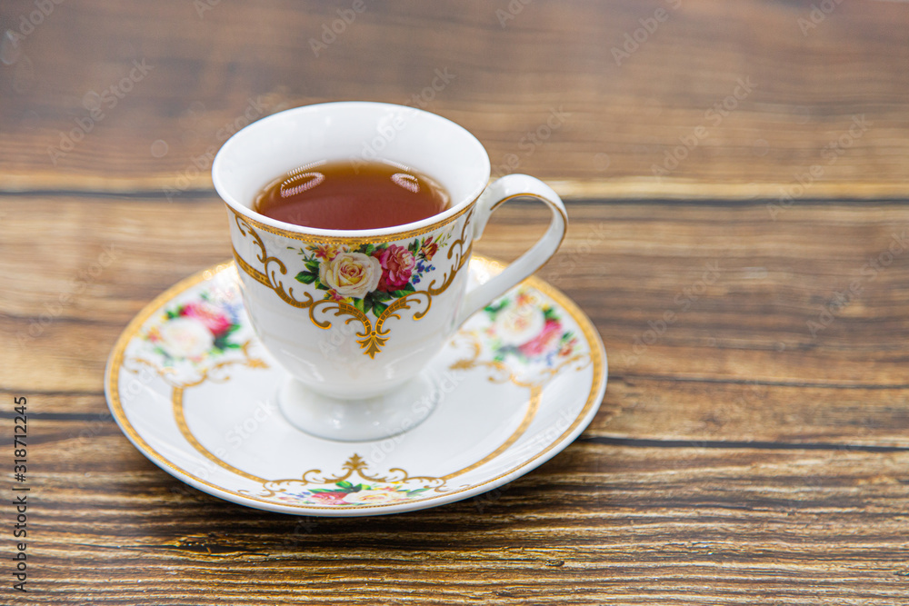 Cup of tea with macaroons on pink background Cup of tea with macaroons on pink background