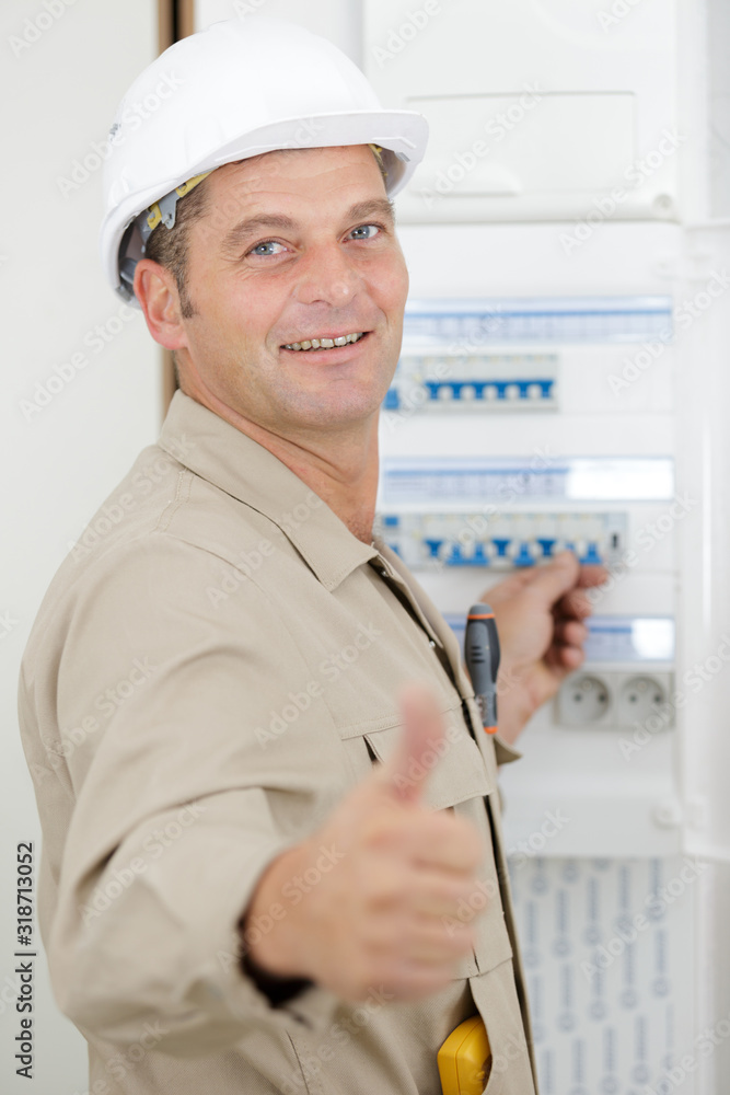 electrician installing energy saving meter electrician installing energy saving meter