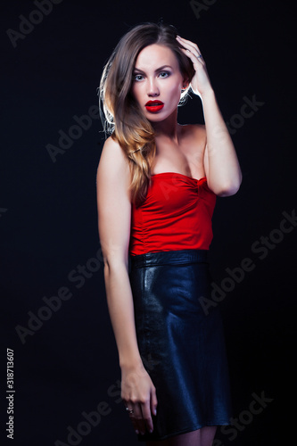 young lady posing emotional on black background, lifestyle people concept