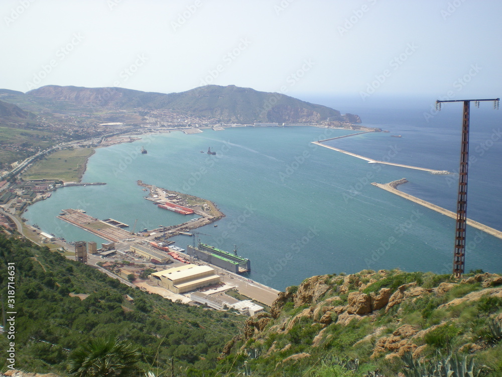Obraz premium Wonderful view from the top of a hill, bay, harbor, city, blue sky and sun, Algeria, Africa